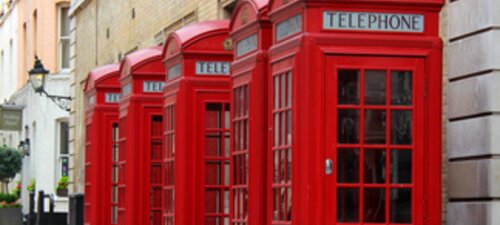 Photo of four red telephone boxes